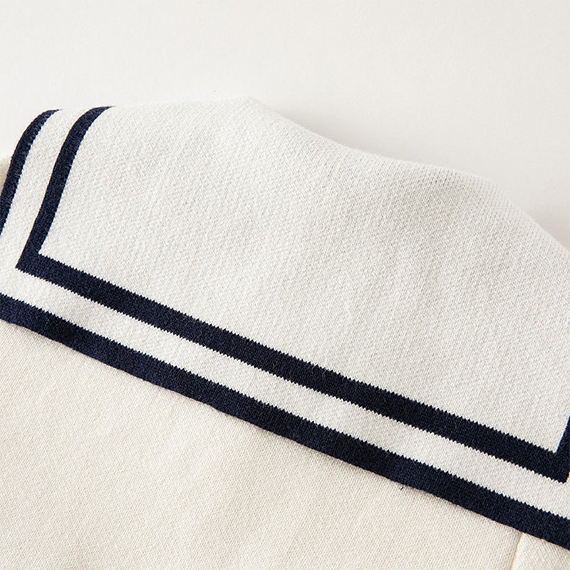 فستان بنات طويل الأكمام من قماش محبوك باللون البيج مع تنورة تول بأسلوب أميرة