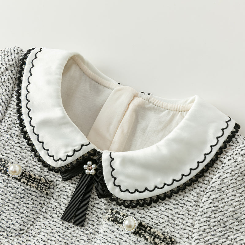 فستان بنات طويل الأكمام من قماش تويد أسود وأبيض مع تنورة تول باللون البيج بأسلوب أميرة