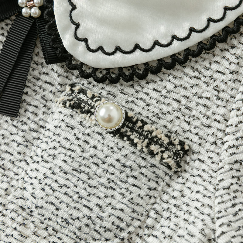 فستان بنات طويل الأكمام من قماش تويد أسود وأبيض مع تنورة تول باللون البيج بأسلوب أميرة