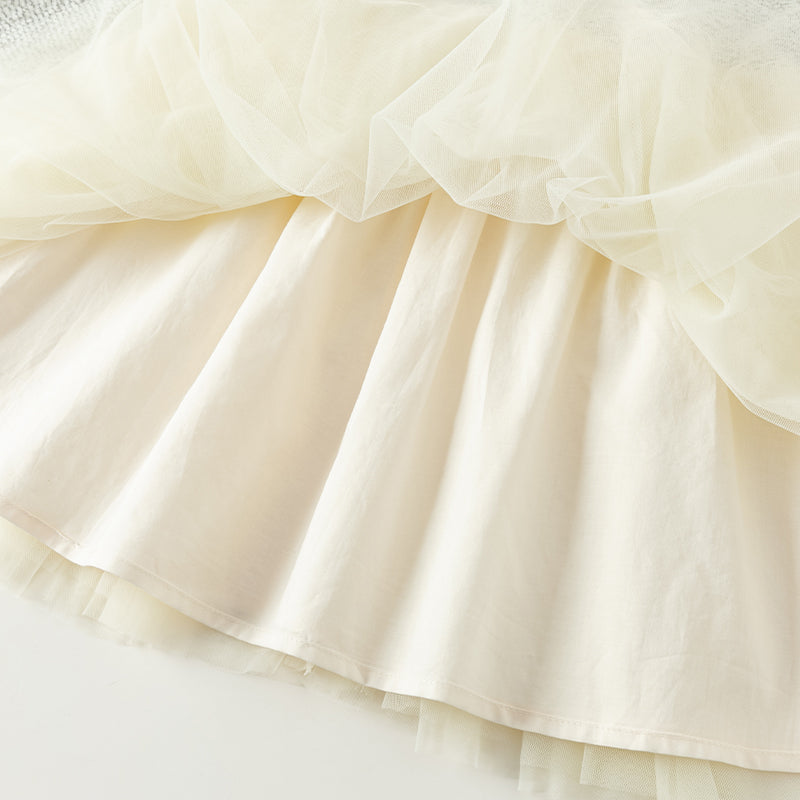 فستان بنات طويل الأكمام من قماش تويد أسود وأبيض مع تنورة تول باللون البيج بأسلوب أميرة